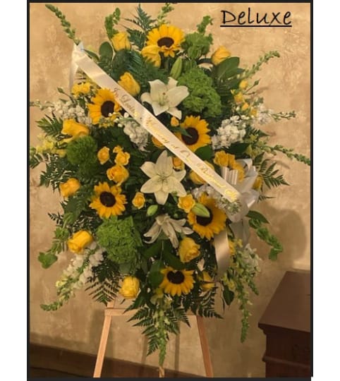 Sunshines Standing Spray. An arrangement by Geni's Florist and Gifts.