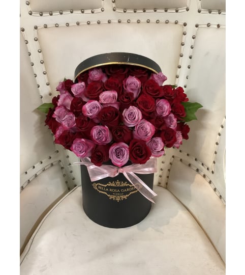 Red and Purple Rose Box. An arrangement by BellaRosa Gardens.