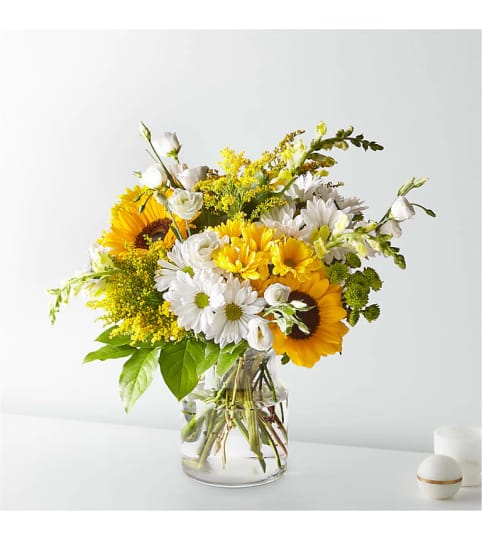 Sunshine in Bloom. An arrangement by Mae's Flowers and Gifts.