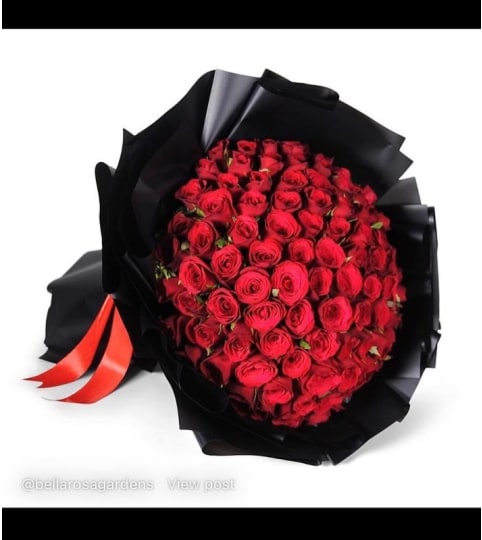100 red roses luxury bouquet. An arrangement by BellaRosa Gardens.