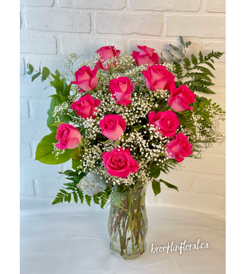 Hot Pink Dozen Roses In A Vase. An arrangement by Brooklin Floral and Garden Shoppe Inc..