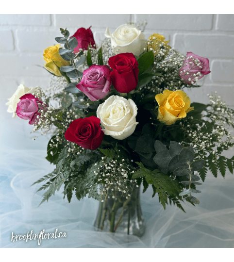 Mixed Colour Dozen Roses In A Vase. An arrangement by Brooklin Floral and Garden Shoppe Inc..