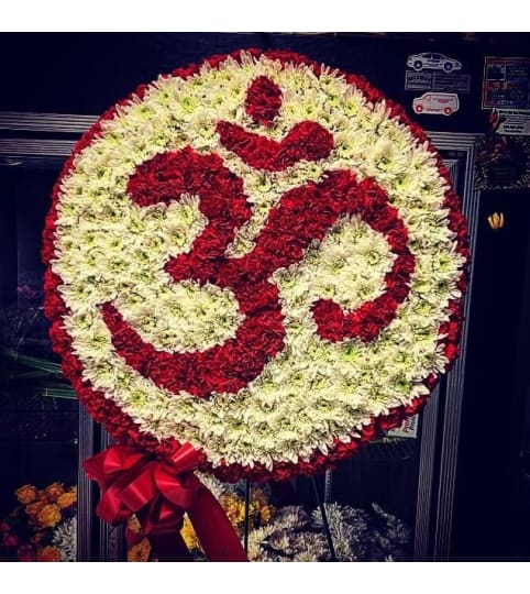 Om symbol. An arrangement by Cielo's Floral Designs.