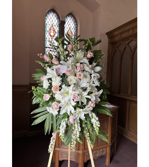 Pastel Peace Spray. An arrangement by Rose Flowers.