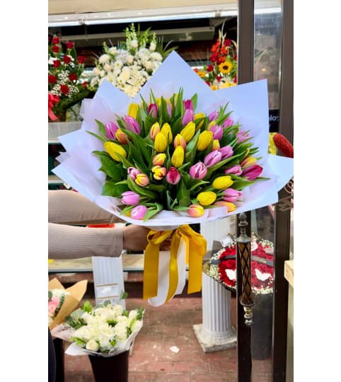 Tulip Extravaganza. An arrangement by Rose Flowers.