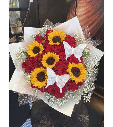 Sunny Rose Butterfly Bouquet. An arrangement by Rose Flowers.