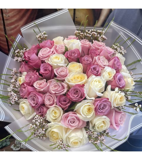 Purple Rosy Delights. An arrangement by Rose Flowers.