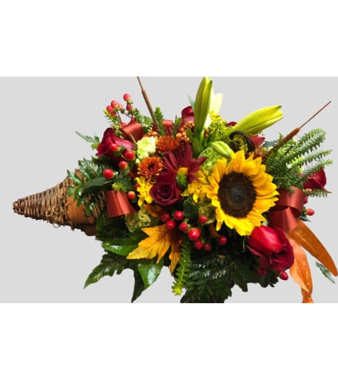 Cornucopia. An arrangement by Charming Blooms.