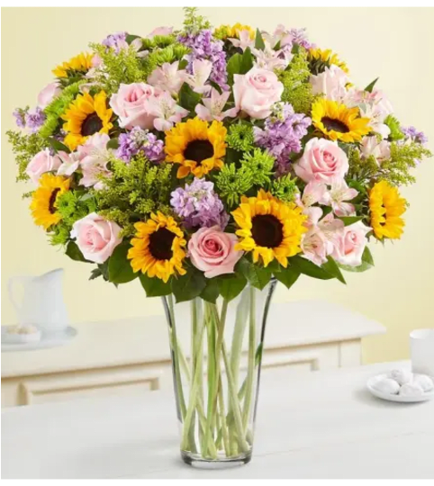 Unique Sunflowers and Rose. An arrangement by Aventura Blooming Petals.