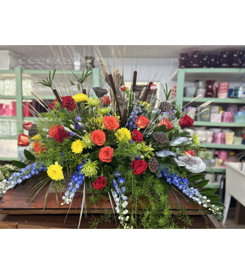 Gone Fishin' in the Skies Casket Spray. An arrangement by Jenilyn's Creations.