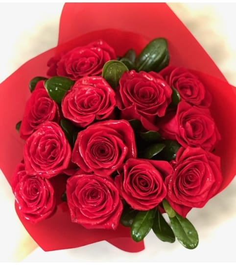 Because I Love You with 12 Red Roses Deluxe Wrap. An arrangement by Say It With Flowers.