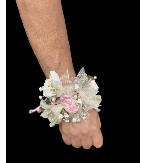 Pretty Pink Wrist Corsage. An arrangement by Loyalist Flowers.