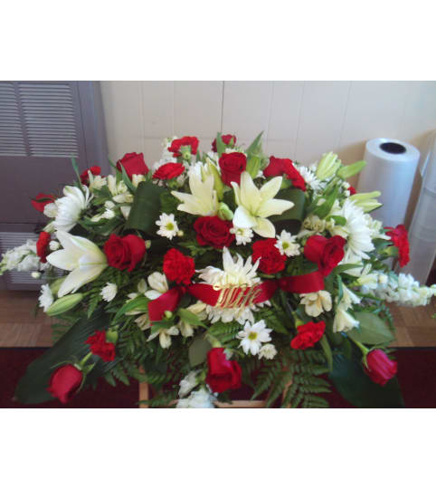 Standard Casket Spray. An arrangement by Heatherton's Florist and Gifts.