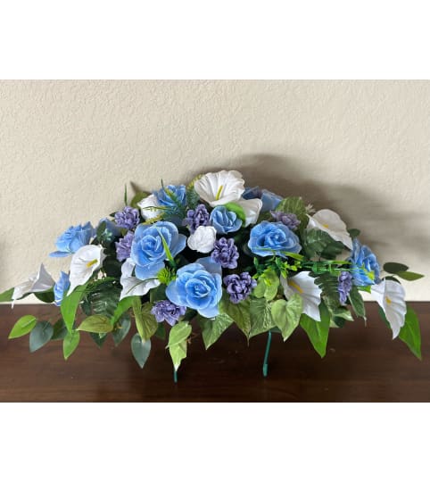 Blue Tombstone Saddle. An arrangement by Loyalist Flowers.