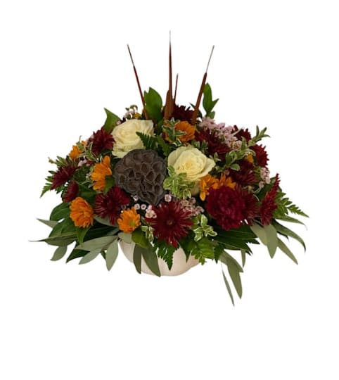 White Ceramic Pumpkin Tablecentre. An arrangement by Loyalist Flowers.