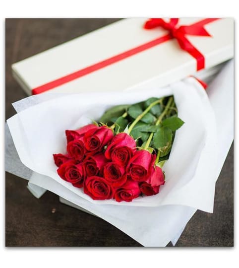 Dozen Long Stem Red Roses in a Box. An arrangement by The Farmers Petals.