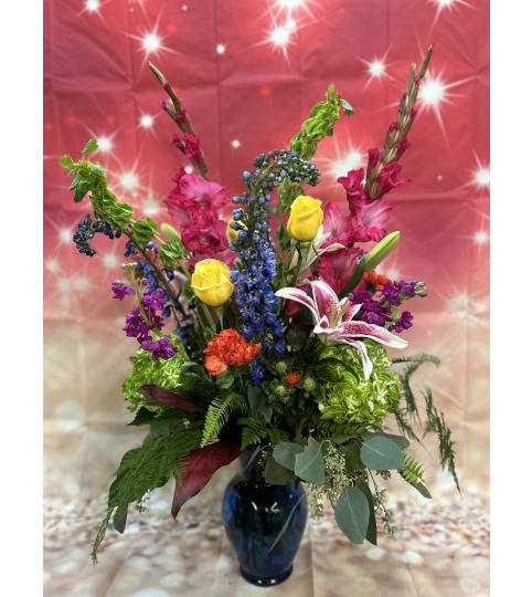 Vibrant Floral Serenade. An arrangement by Flowers by Neil.