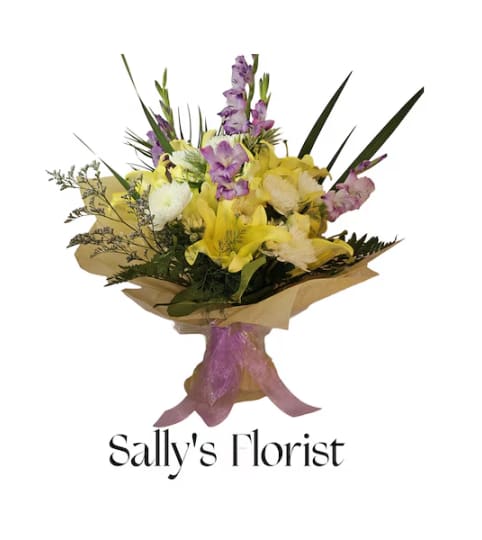 Sally's Tropical Sunrise Bouquet. An arrangement by Triple A Florist.
