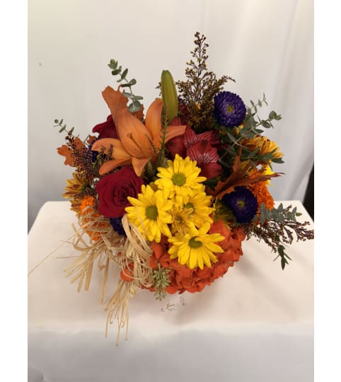Harvest Blooms. An arrangement by Commerce Flowers.