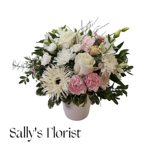 Sally Sympathy of Harmony. An arrangement by Triple A Florist.