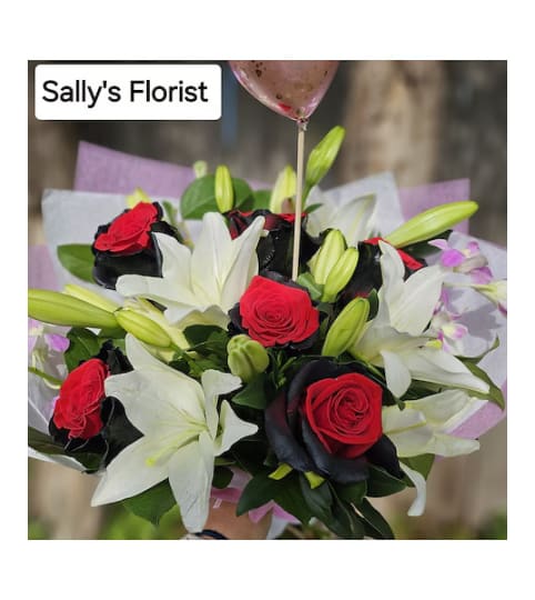 Sally's Darkness meet Light Bouquet. An arrangement by Triple A Florist.