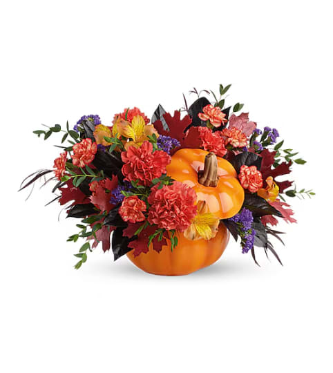 Teleflora's Hauntingly Pretty Pumpkin Bouquet. An arrangement by Triple A Florist.