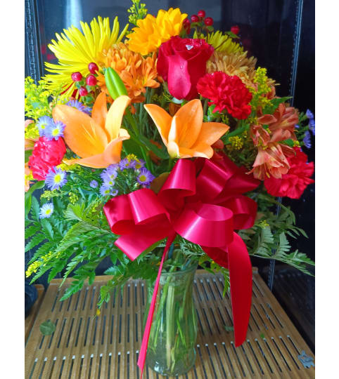 Autumn Sunset Bliss. An arrangement by Howard Beach Florist.