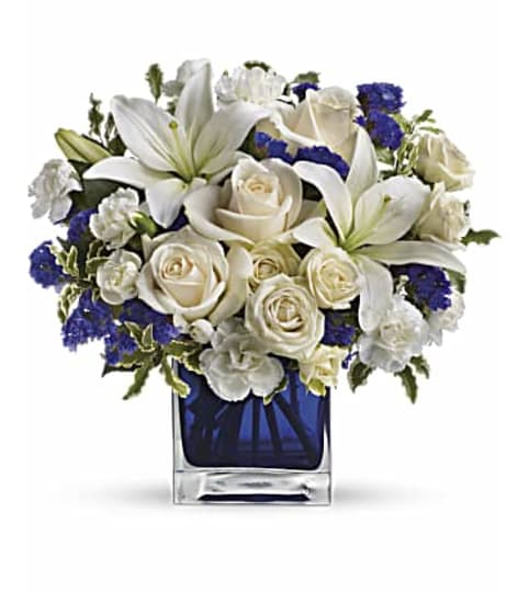 Serenity in White. An arrangement by Brasco Florist.