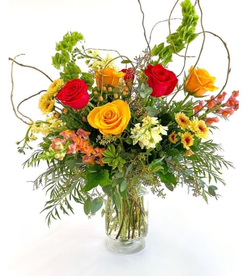 Fiery Evergreen. An arrangement by Marianna's Flower Island.