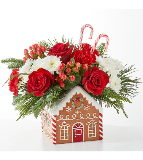 Christmas Bakery Gingerbread House. An arrangement by Rocio Flower Shop.