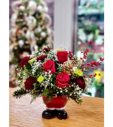santa claus. An arrangement by Sunshine Flowers.