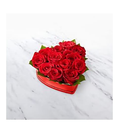 Sally's Red Roses Heart Box. An arrangement by Triple A Florist.