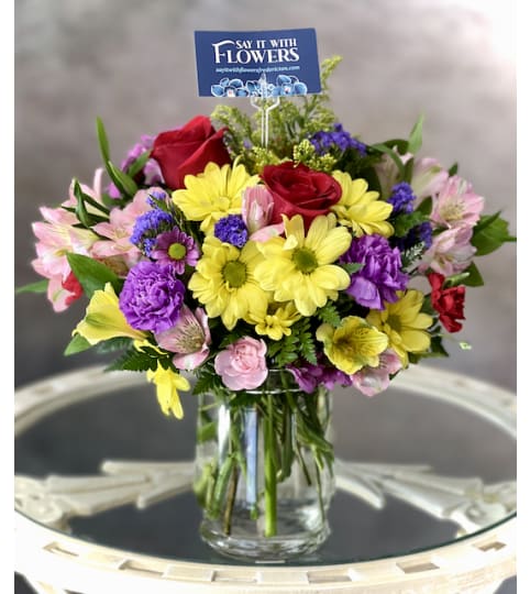 Celebrate Good Times. An arrangement by Say It With Flowers.