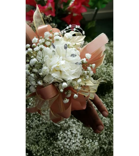 Pure Elegance Carnation Corsage. An arrangement by Ebony's Flowers and Gifts.