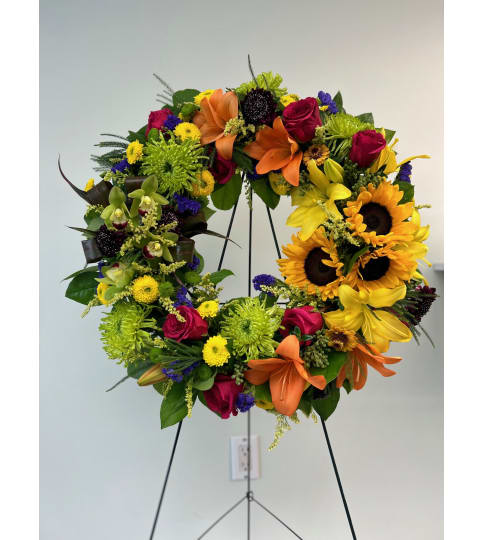 Light of your life sympathy Wreath. An arrangement by Blossoms On The Trail.