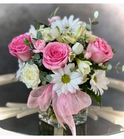 SIWF - She is so darling. An arrangement by Say It With Flowers.