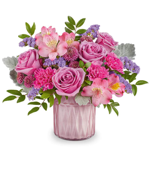 Teleflora's Enchanted Oasis Bouquet. An arrangement by Sueppel's Flowers.