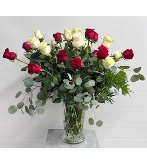 Two Dozen Mixed Color Arranged. An arrangement by Blooming Boutique Florist.
