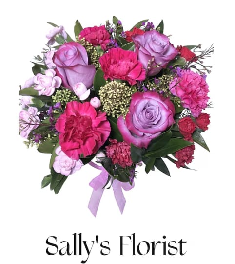 Sally’s Amour en Lavander. An arrangement by Triple A Florist.