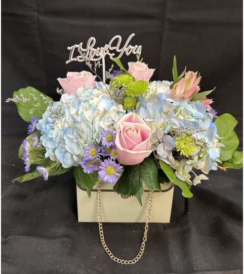 Enchanted Pastel Charm. An arrangement by Flowers by Neil.