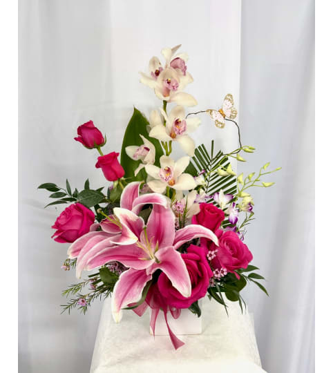 Love You Mom. An arrangement by Commerce Flowers.