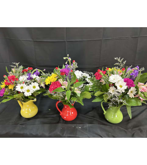 Petal Parade Pitcher. An arrangement by Flowers by Neil.