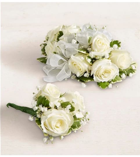White Boutonniere and Corsage. An arrangement by Anthurium Gardens Florist.