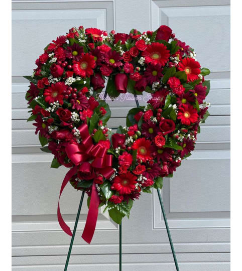 BLOSSOM RED OPEN HEART WREATH. An arrangement by Illusion Flower Shop.