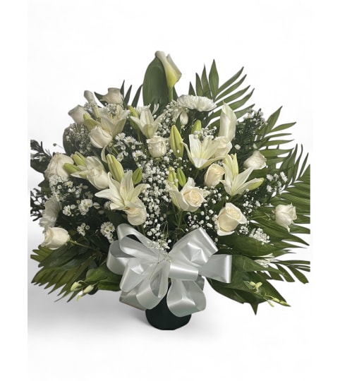 Whispering White Blooms. An arrangement by Cinderella's Flowers.