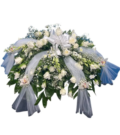Pure Serenity Blooms Casket Spray. An arrangement by Cinderella's Flowers.