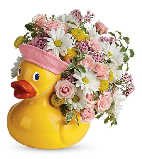 Teleflora's Sweet Little Ducky Bouquet. An arrangement by Believe Flowers.