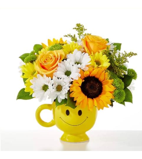 The FTD Be Happy Bouquet. An arrangement by Believe Flowers.