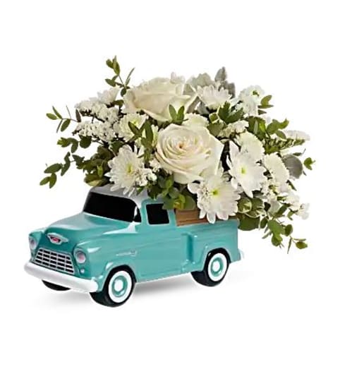 Teleflora's Classic Chevy Pickup Bouquet. An arrangement by Believe Flowers.