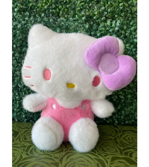 Cat Plush in Pink Overalls with Lavender Bow. An arrangement by Flower World and Gifts.